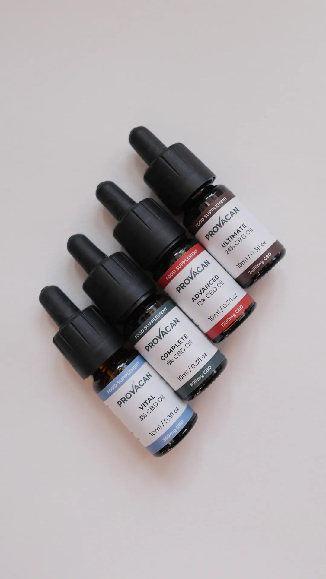 Provacan Bestsellers CBD Wellness Products: Vital 3% 300mg CBD oil, Complete 6% 600mg CBD oil, Advanced 12% 1200mg CBD oil and Ultimate 24% 2400mg CBD oil, aligned next to each other on a white table