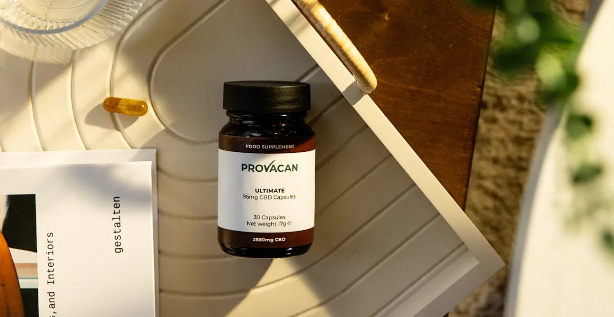 CBD capsules from Provacan: Ultimate 96mg CBD capsules on a white tray next to a book