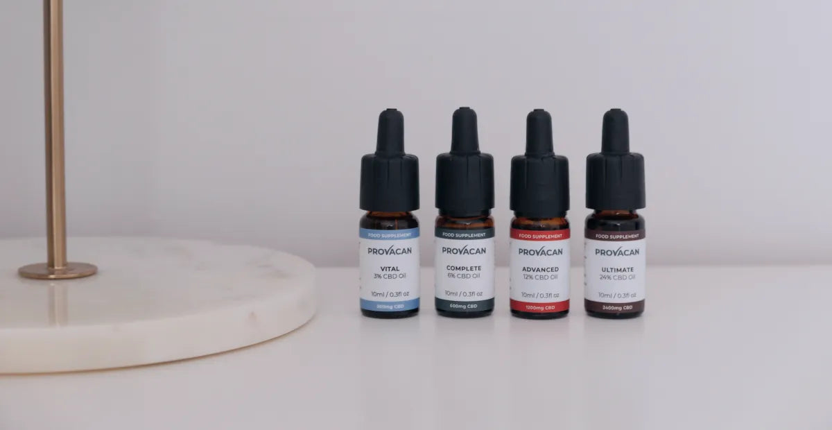 CBD oil from Provacan: Vital 300mg CBD oil, Complete 600mg CBD oil, Advanced 1200mg CBD oil, Ultimate 2400mg CBD oil on a white desk