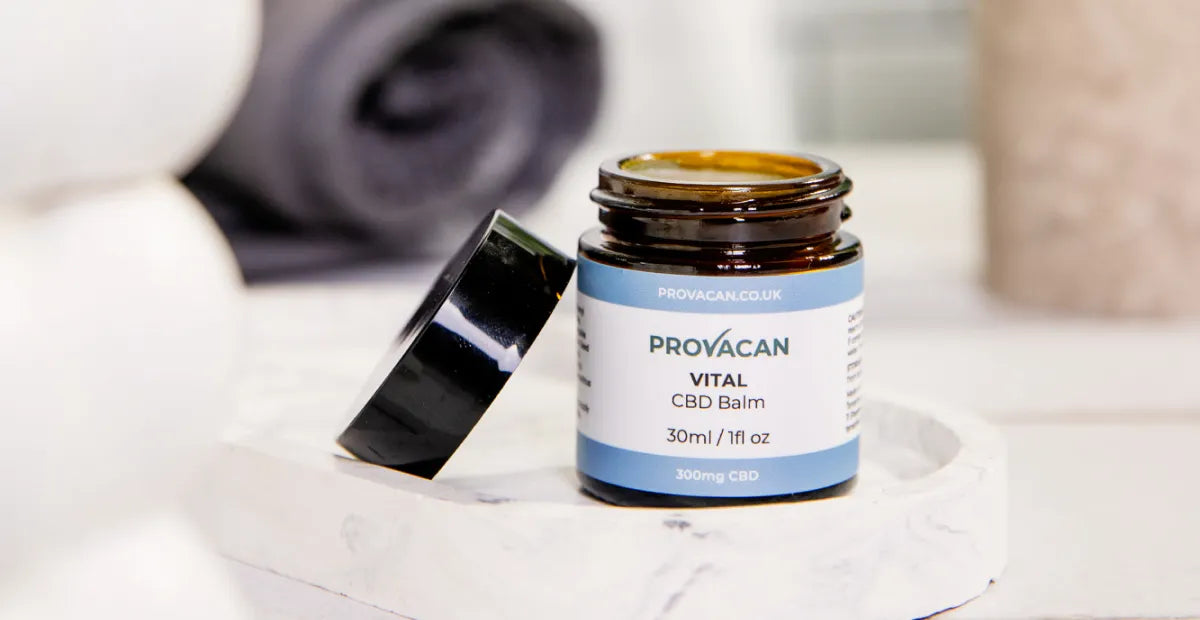 Provacan Vital 300mg CBD / 1% CBD Balm jar opened on a marble tray