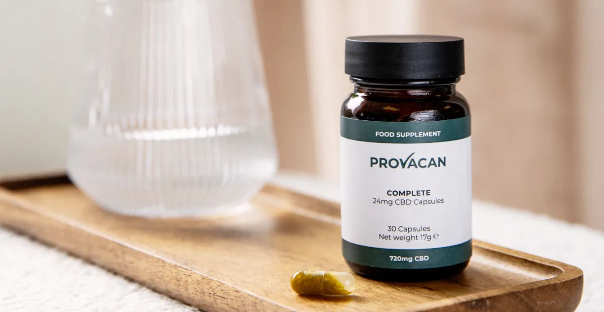 Provacan Natural Stress Relief: Complete 24mg CBD Capsules on a wooden tray