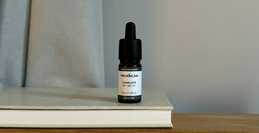 Provacan CBD for Stress: Provacan Complete 6% 600mg CBD Oil on a book on a bedside table