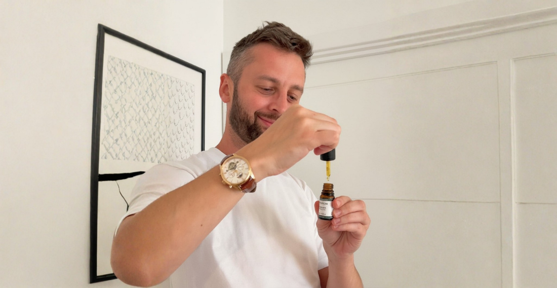 Man holding a dropper of Provacan Complete 600mg 6% CBD oil