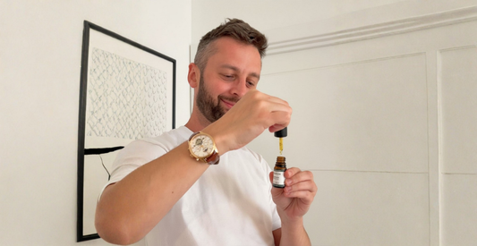 Man holding a dropper of Provacan Complete 600mg 6% CBD oil