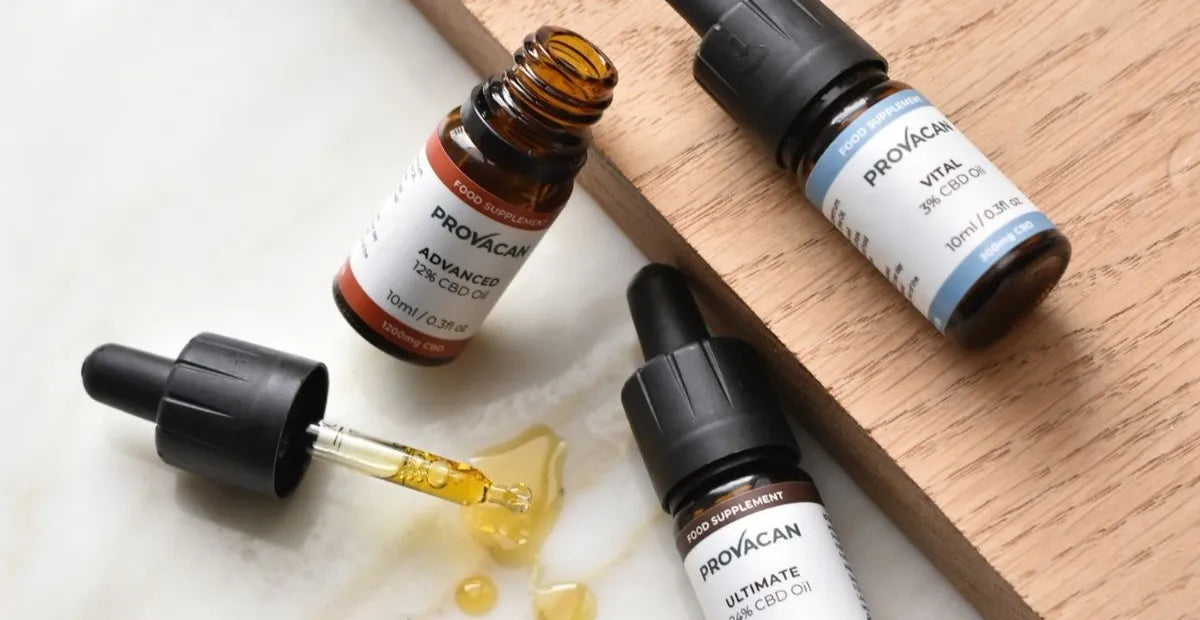 Provacan Bestsellers CBD Wellness Products: Advanced 12% 1200mg CBD oil, Ultimate 24% 2400mg CBD oil, Vital 3% 300mg CBD oil with the oil dropper next to them on a wooden tray 