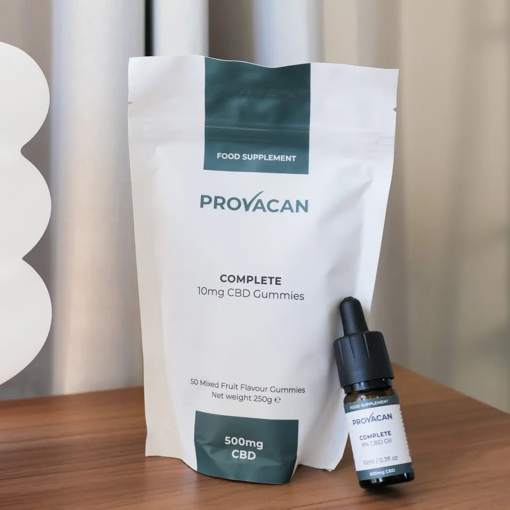 Provacan Black Friday exclusive Calm CBD bundle including Complete 10mg CBD gummies and Complete CBD 6% 600mg oil on a wooden desk