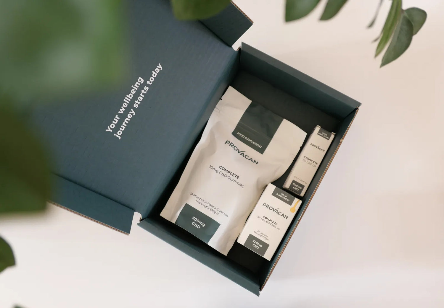 Opened dark green Provacan CBD subscription Welcome Kit with Complete 10mg CBD Gummies, Complete 600mg CBD oil and Complete 24mg CBD Capsules