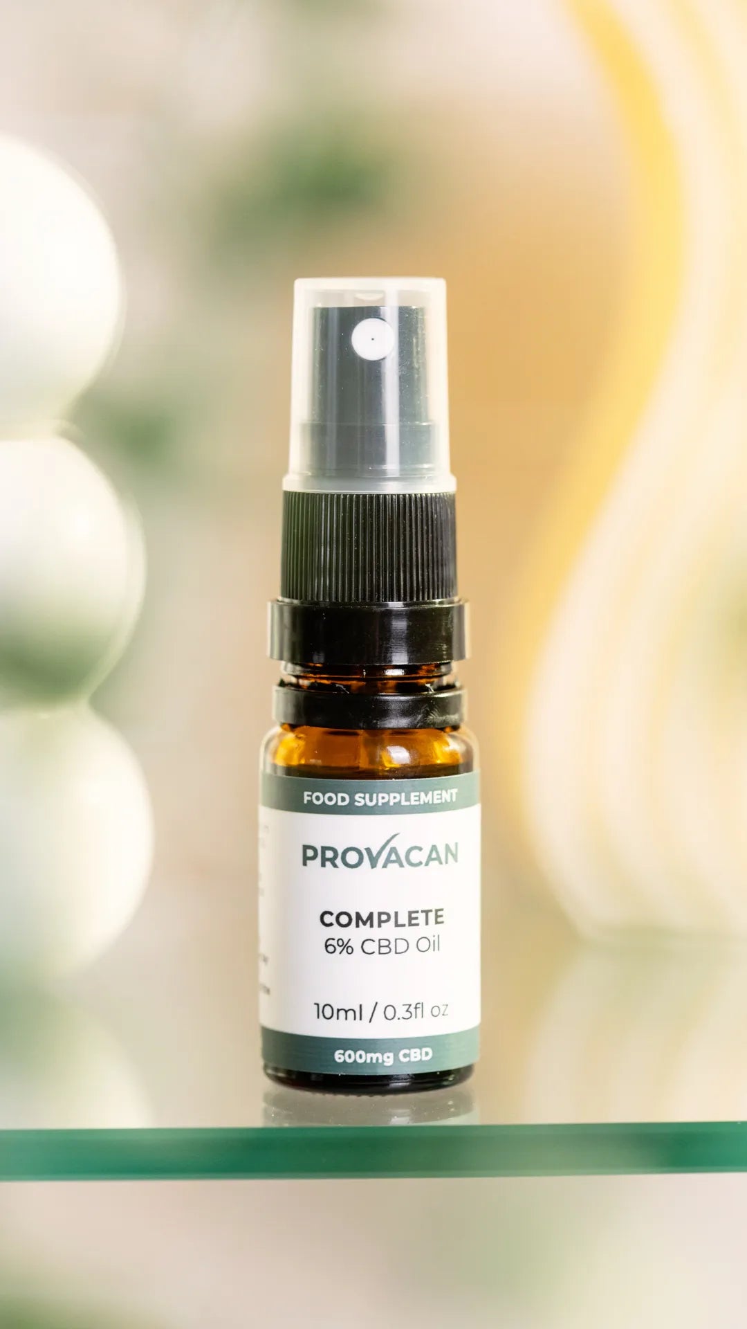 Provacan Complete CBD oil 6% 600mg bottle on a blurred background