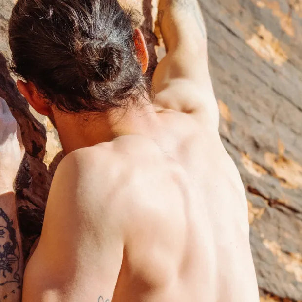 Man from the back climbing