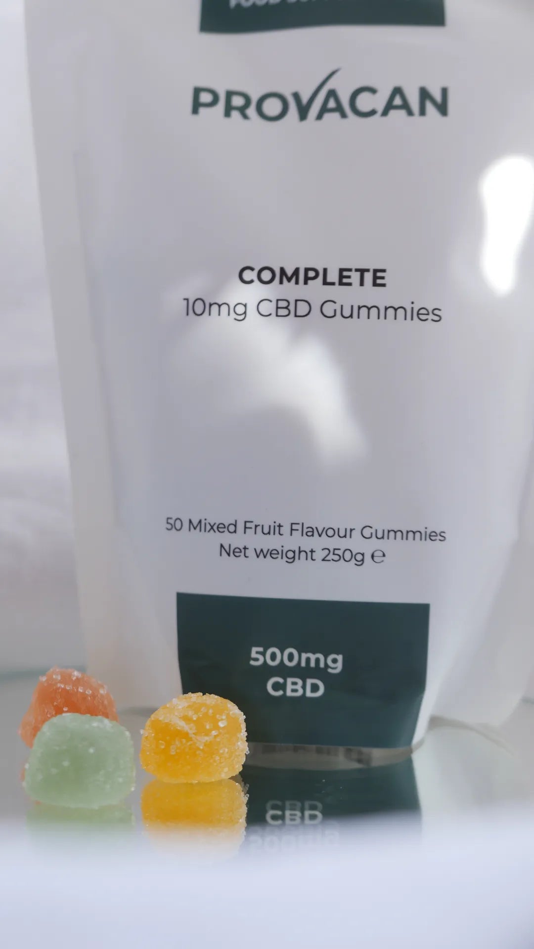 Bag of Provacan vegan CBD gummies 10mg with 3 colourful gummies at the front