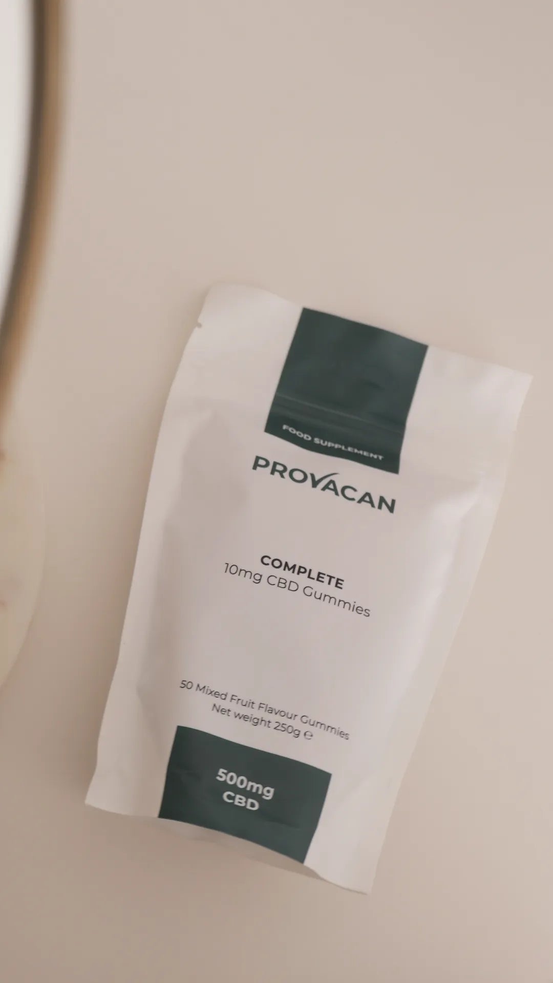 Bag of Provacan vegan CBD gummies on a beige background